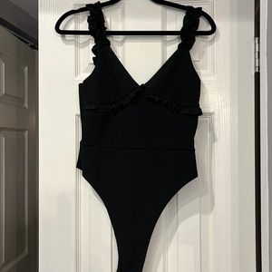 Black Bodysuit by Nasty Gal. Size 10. Ruffled Strap.